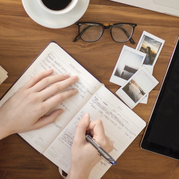 woman writing in notebook