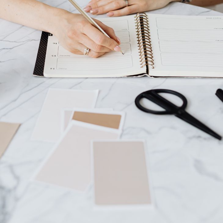 woman writing in a notebook